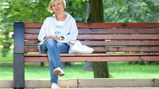 Continuing to Grow: Seeking Knowledge, Wisdom, and Intuition smiling woman seated on a public bench