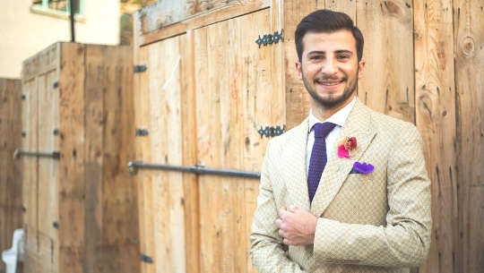 Mentors, Men, and Leaning Into Closed Doors young white man wearing a suit standing in from of closed doors