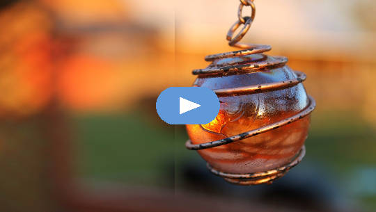 Believe In Your Own Beauty a glowing orb in a pendant with a copper wire wrap