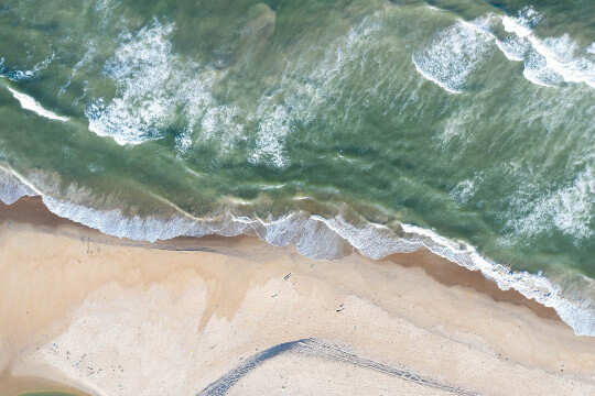Horoscope Week: February 8 - 14, 2021 aerial image of waves and beach (Horoscope Week: February 8 - 14, 2021)