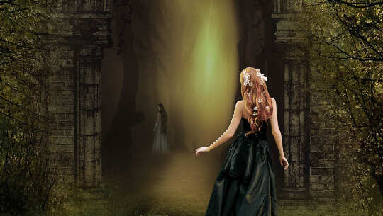 Changing Your Nightmares or Fearful Dreams Into Pleasant Experiences image of a girl looking into a gloomy forest but with light ray shining through