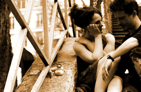 Does Genuine Sex Education Require Esoteric Techniques? picutre of a couple sitting on stairway talking