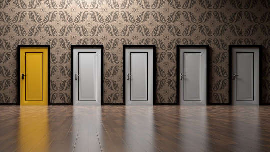 Where Do We Go From Here? five closed doors, one pained yellow, the others white