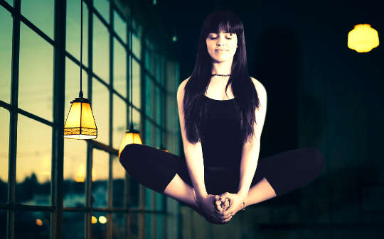 Neuroscience and Consciousness: Some Things Are Just A Mystery woman meditating and levitating