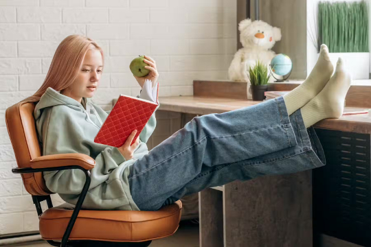 Mastering Study Habits: The Essential Guide to Daily Learning a young girl studying and eating an apple