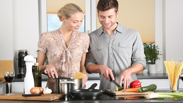 What Do Women Deserve in a Relationship? a man and woman preparing food together in the kitchen