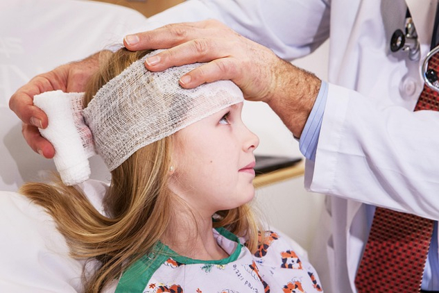 Healing the Mind and the Broken Heart a woman with a head bandage in a hospital setting