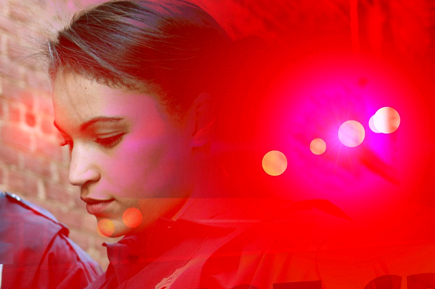 Getting to Know Your Psychic Senses young woman with eyes closed surrounded by lights
