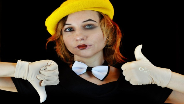 Why Steve Jobs Was Wrong About Passion Leading to Success Image of a girl with clown face with one hand in a thumbs up, the other thumbs down. Image by Victoria from Pixabay.